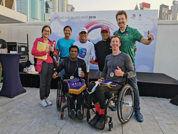 Para-athletes rowing during the Around the Island Race